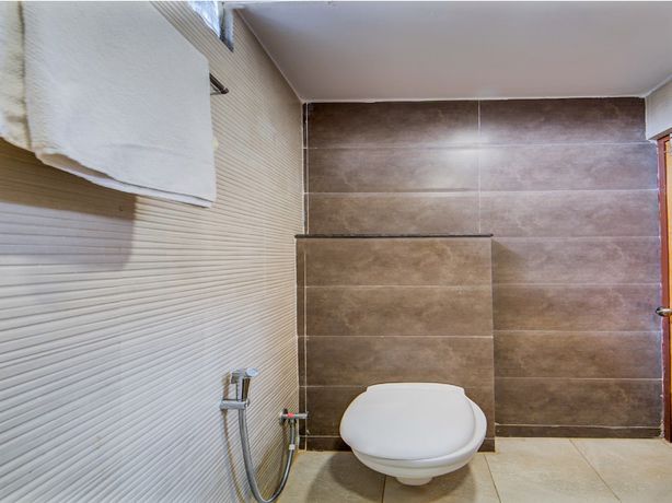 Imagen de la habitación del Hotel Capital O 15141 Townvilla Guest House. Foto 15