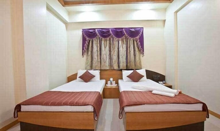 Imagen de la habitación del Hotel Capital O 18973 Summit. Foto 8