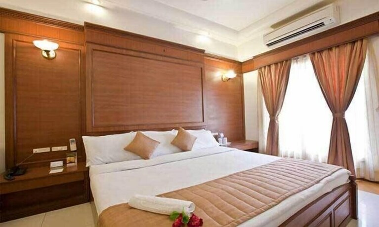 Imagen de la habitación del Hotel Capital O 18973 Summit. Foto 12