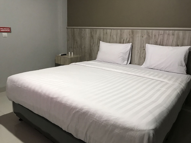 Imagen de la habitación del Hotel Capital O 1898 Louise Place. Foto 2