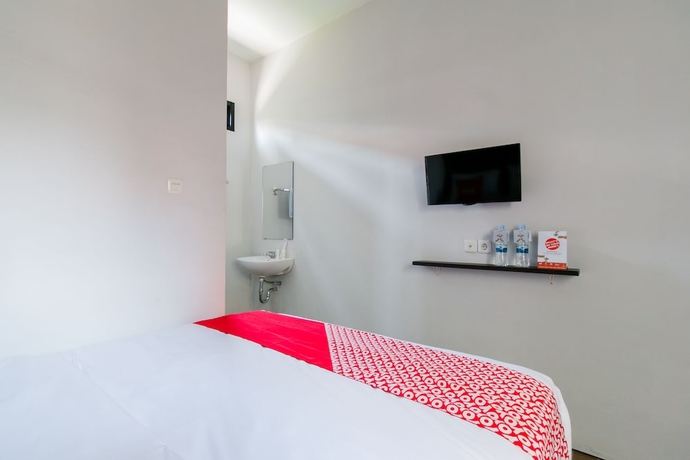 Imagen de la habitación del Hotel Capital O 1898 Louise Place. Foto 4