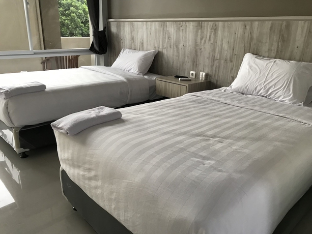 Imagen de la habitación del Hotel Capital O 1898 Louise Place. Foto 5