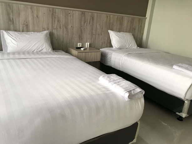 Imagen de la habitación del Hotel Capital O 1898 Louise Place. Foto 6