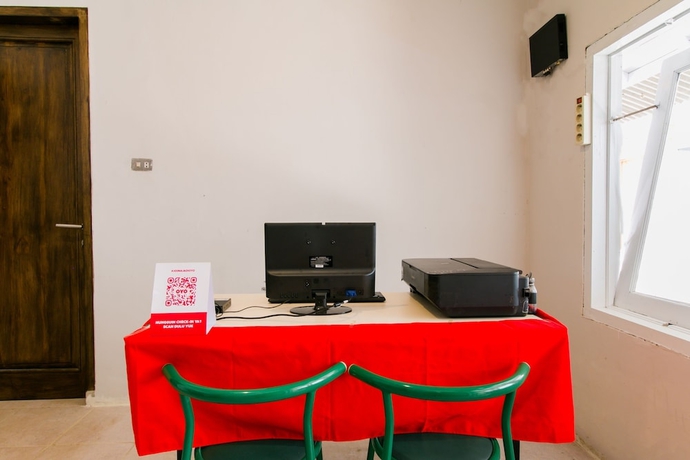 Imagen de los interiores del Hotel Capital O 1898 Louise Place. Foto 18