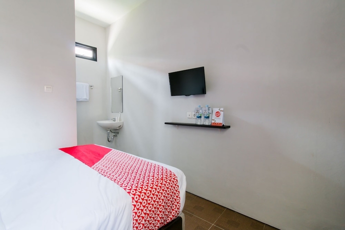 Imagen de la habitación del Hotel Capital O 1898 Louise Place. Foto 7