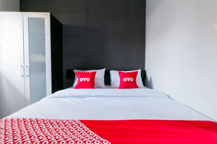 Imagen de la habitación del Hotel Capital O 1898 Louise Place. Foto 8