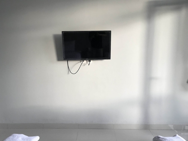 Imagen de la habitación del Hotel Capital O 1898 Louise Place. Foto 10