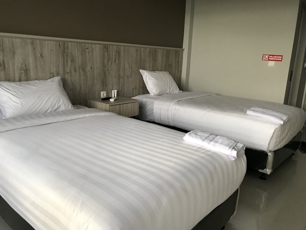 Imagen de la habitación del Hotel Capital O 1898 Louise Place. Foto 11