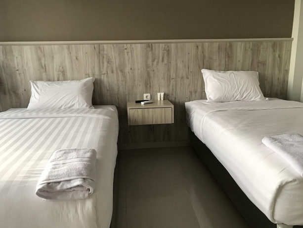 Imagen de la habitación del Hotel Capital O 1898 Louise Place. Foto 14