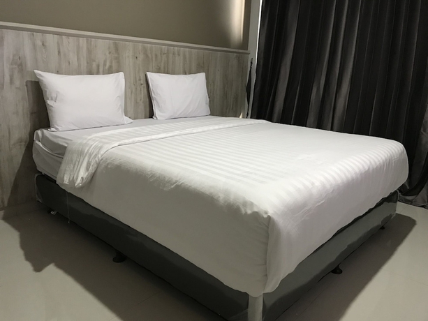 Imagen de la habitación del Hotel Capital O 1898 Louise Place. Foto 16