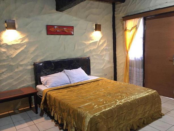 Imagen de la habitación del Hotel Capital O 2640 Cottage GS Rumah Kayu Syariah. Foto 5