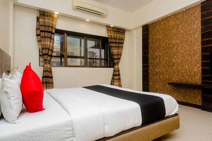 Imagen de la habitación del Hotel Capital O 27600 Sai Plaza. Foto 8