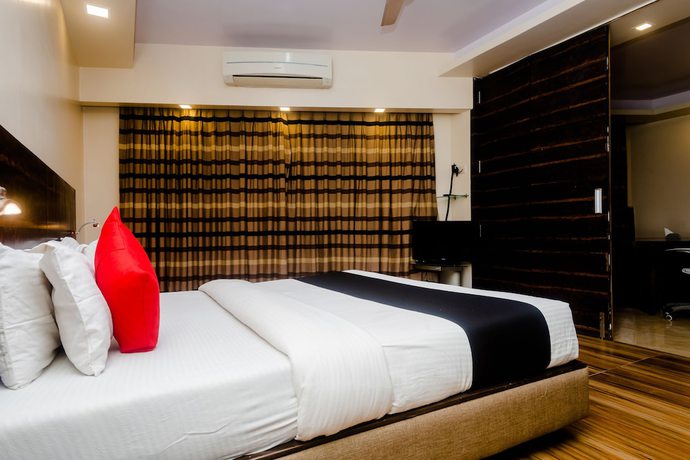 Imagen de la habitación del Hotel Capital O 27600 Sai Plaza. Foto 9