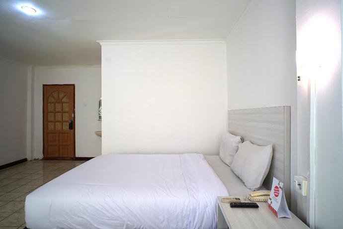 Imagen de la habitación del Hotel Capital O 2885 Hemra. Foto 6