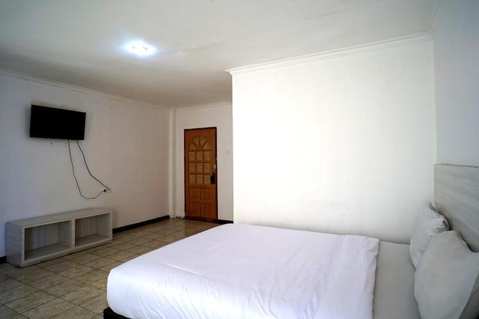 Imagen de la habitación del Hotel Capital O 2885 Hemra. Foto 8