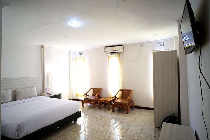 Imagen de la habitación del Hotel Capital O 2885 Hemra. Foto 9