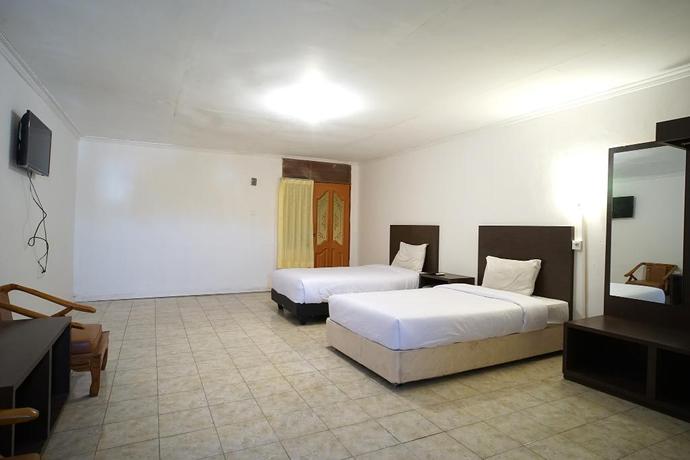 Imagen de la habitación del Hotel Capital O 2885 Hemra. Foto 12