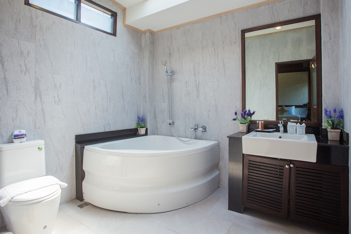 Imagen de la habitación del Hotel Capital O 370 Nernkhao Resort. Foto 13