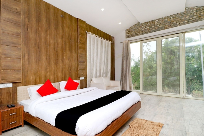 Imagen de la habitación del Hotel Capital O 3864 Master Farm. Foto 6