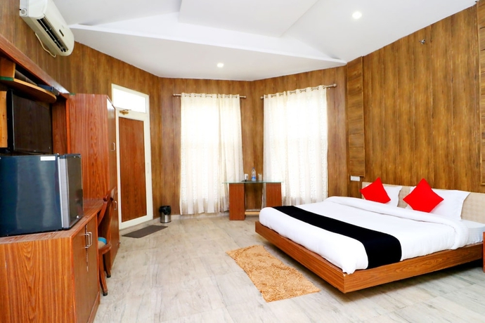 Imagen de la habitación del Hotel Capital O 3864 Master Farm. Foto 8