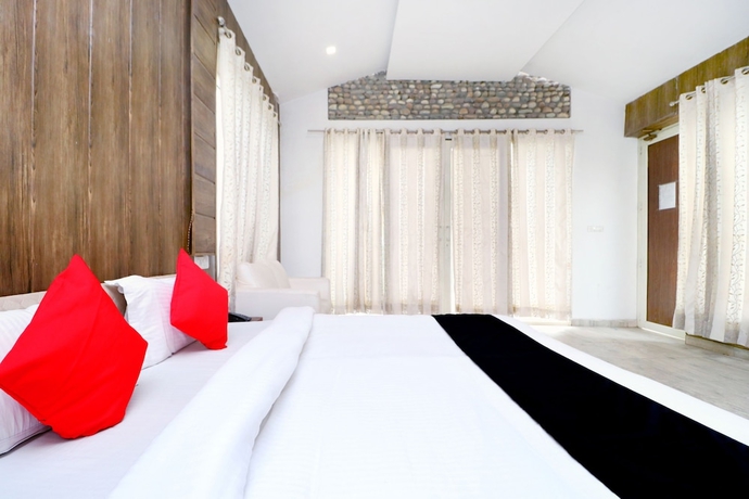 Imagen de la habitación del Hotel Capital O 3864 Master Farm. Foto 11