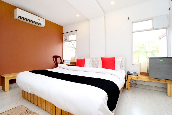 Imagen de la habitación del Hotel Capital O 3864 Master Farm. Foto 13