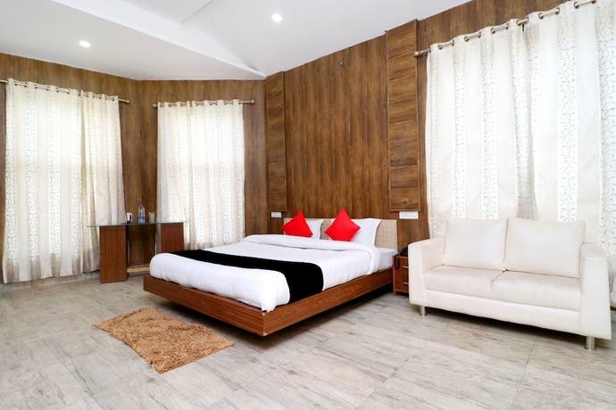 Imagen de la habitación del Hotel Capital O 3864 Master Farm. Foto 14