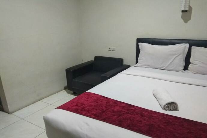 Imagen de la habitación del Hotel Capital O 454 Raising. Foto 4
