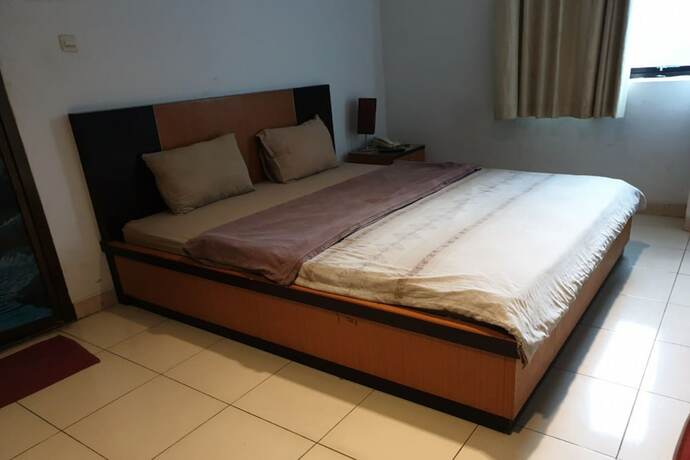 Imagen de la habitación del Hotel Capital O 454 Raising. Foto 7