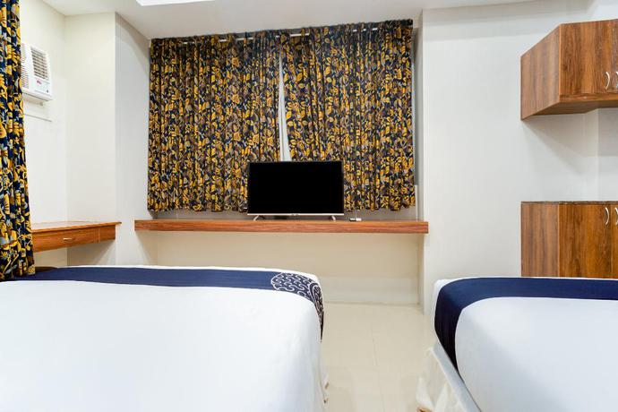 Imagen de la habitación del Hotel Capital O 460 World Palace. Foto 5