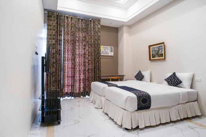 Imagen de la habitación del Hotel Capital O 460 World Palace. Foto 10