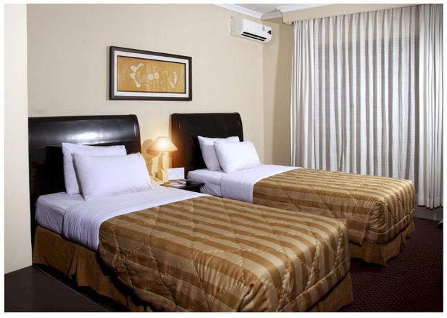 Imagen de la habitación del Hotel Capital O 534 Sriwijaya. Foto 15
