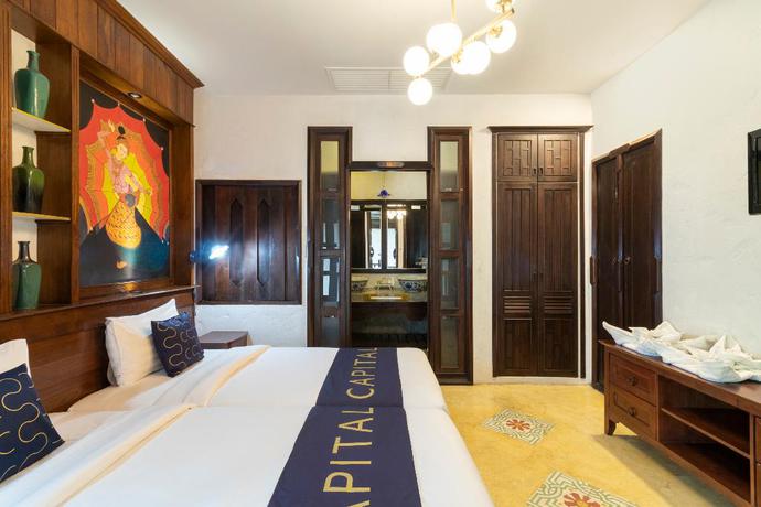Imagen de la habitación del Hotel Capital O 707 Cheva Gallery. Foto 11