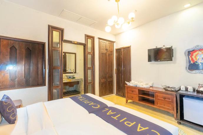 Imagen de la habitación del Hotel Capital O 707 Cheva Gallery. Foto 13