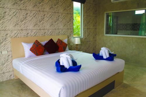 Imagen de la habitación del Hotel Capital O 729 Amantra Lake View Resort. Foto 3