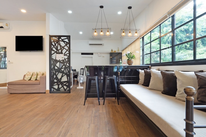 Imagen de los interiores del Hotel Capital O 75379 Sabai Living Pattaya. Foto 12