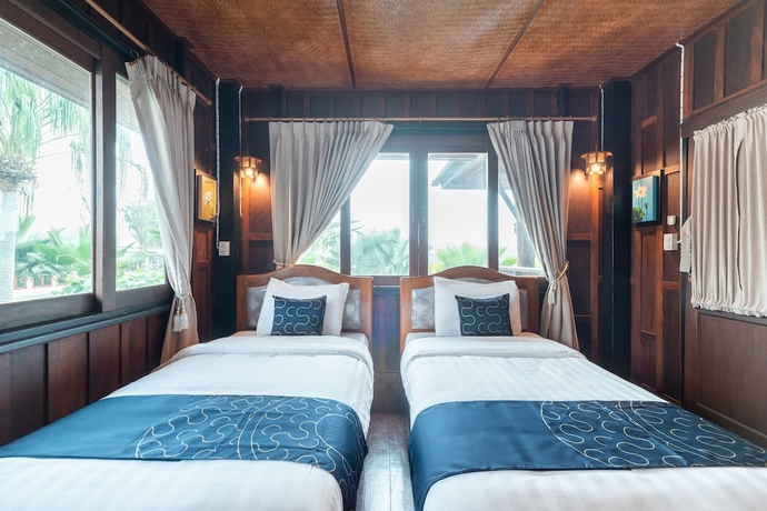 Imagen de la habitación del Hotel Capital O 805 Suan Palm Farm Nok Resort. Foto 2