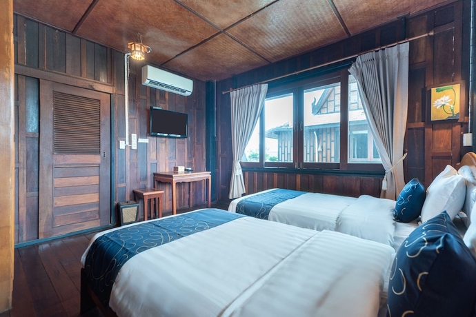 Imagen de la habitación del Hotel Capital O 805 Suan Palm Farm Nok Resort. Foto 3