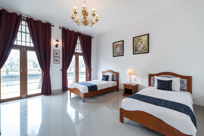 Imagen de la habitación del Hotel Capital O 805 Suan Palm Farm Nok Resort. Foto 8