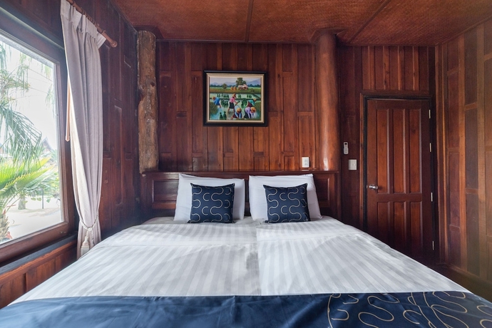 Imagen de la habitación del Hotel Capital O 805 Suan Palm Farm Nok Resort. Foto 11