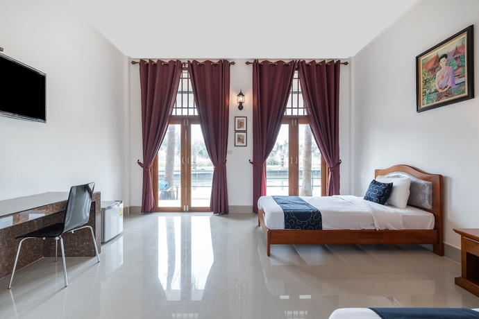 Imagen de la habitación del Hotel Capital O 805 Suan Palm Farm Nok Resort. Foto 13