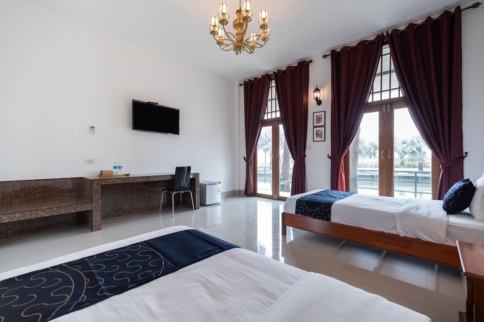 Imagen de la habitación del Hotel Capital O 805 Suan Palm Farm Nok Resort. Foto 14