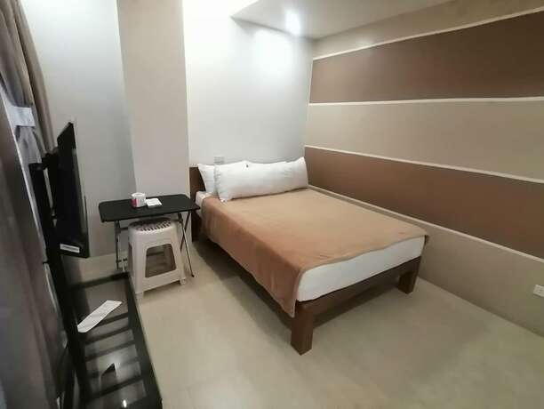 Imagen de la habitación del Hotel Capital O 811 Tri A\'s Building. Foto 16