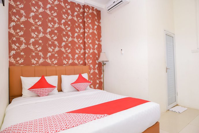 Imagen de la habitación del Hotel Capital O 854 Ub Caisar. Foto 2