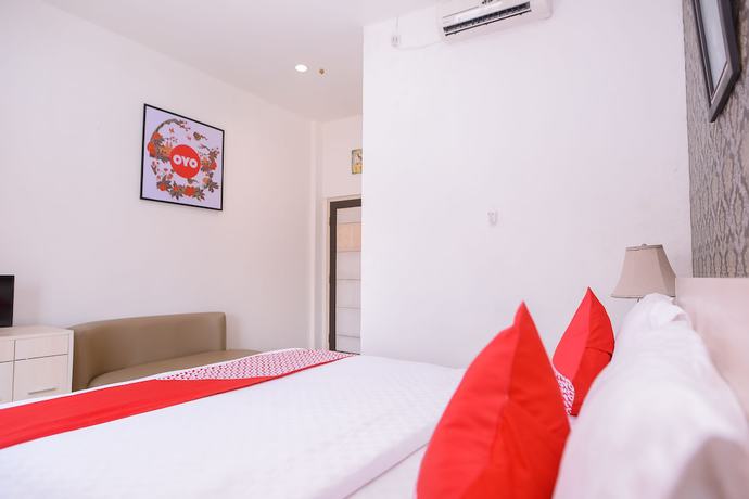 Imagen de la habitación del Hotel Capital O 854 Ub Caisar. Foto 3