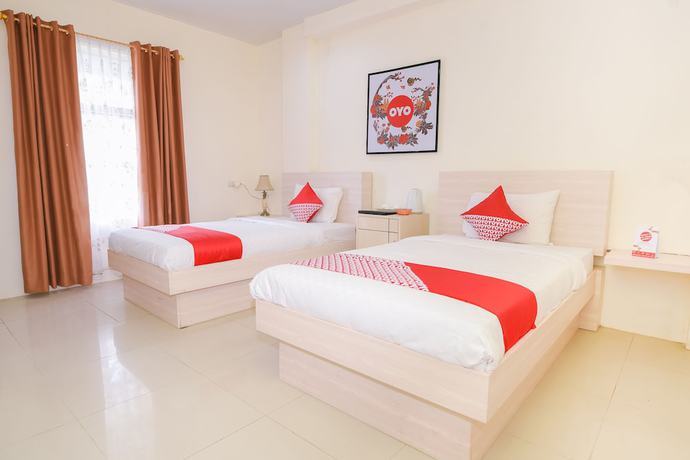 Imagen de la habitación del Hotel Capital O 854 Ub Caisar. Foto 4