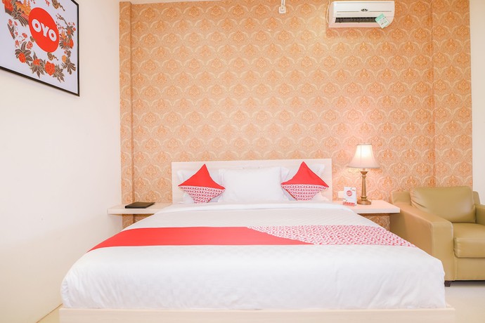 Imagen de la habitación del Hotel Capital O 854 Ub Caisar. Foto 6
