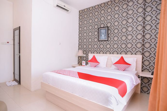 Imagen de la habitación del Hotel Capital O 854 Ub Caisar. Foto 9