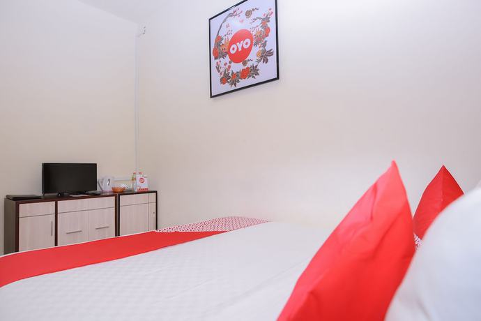 Imagen de la habitación del Hotel Capital O 854 Ub Caisar. Foto 11