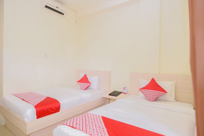 Imagen de la habitación del Hotel Capital O 854 Ub Caisar. Foto 12